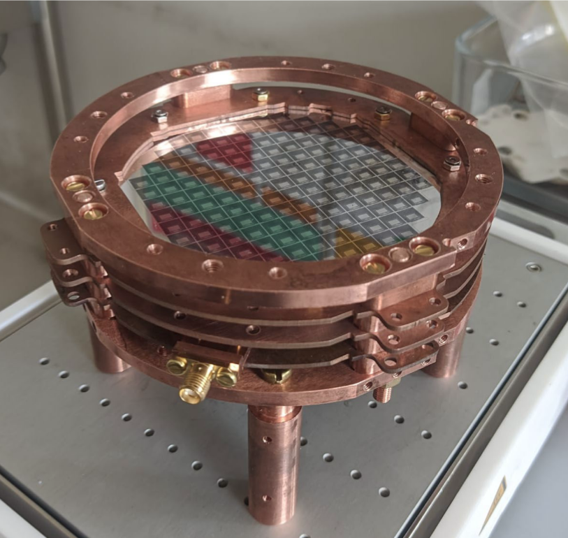 Three layers stack of BULLKID detectors on Silicon substrate. Each layer hosts over 100 Kinetic Inductance Detectors for phonon-mediated detection. The full experiment will feature 16 layers.