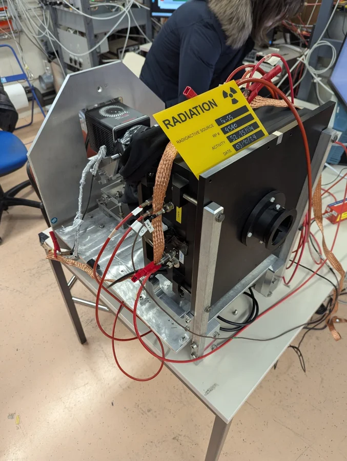 Prototype detector under test with radioactive-source calibration hardware