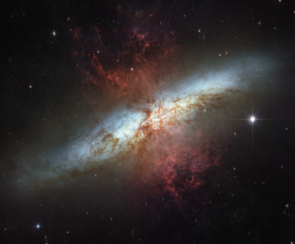 This mosaic image is the sharpest wide-angle view ever obtained of the starburst galaxy, Messier 82 (M82). The galaxy is remarkable for its bright blue disk, webs of shredded clouds and fiery-looking plumes of glowing hydrogen blasting out of its central regions.Throughout the galaxy's center, young stars are being born 10 times faster than they are inside our entire Milky Way Galaxy. Credit: NASA, ESA, and The Hubble Heritage Team (STScI/AURA); Acknowledgment: J. Gallagher (University of Wisconsin), M. Mountain (STScI), and P. Puxley (National Science Foundation)